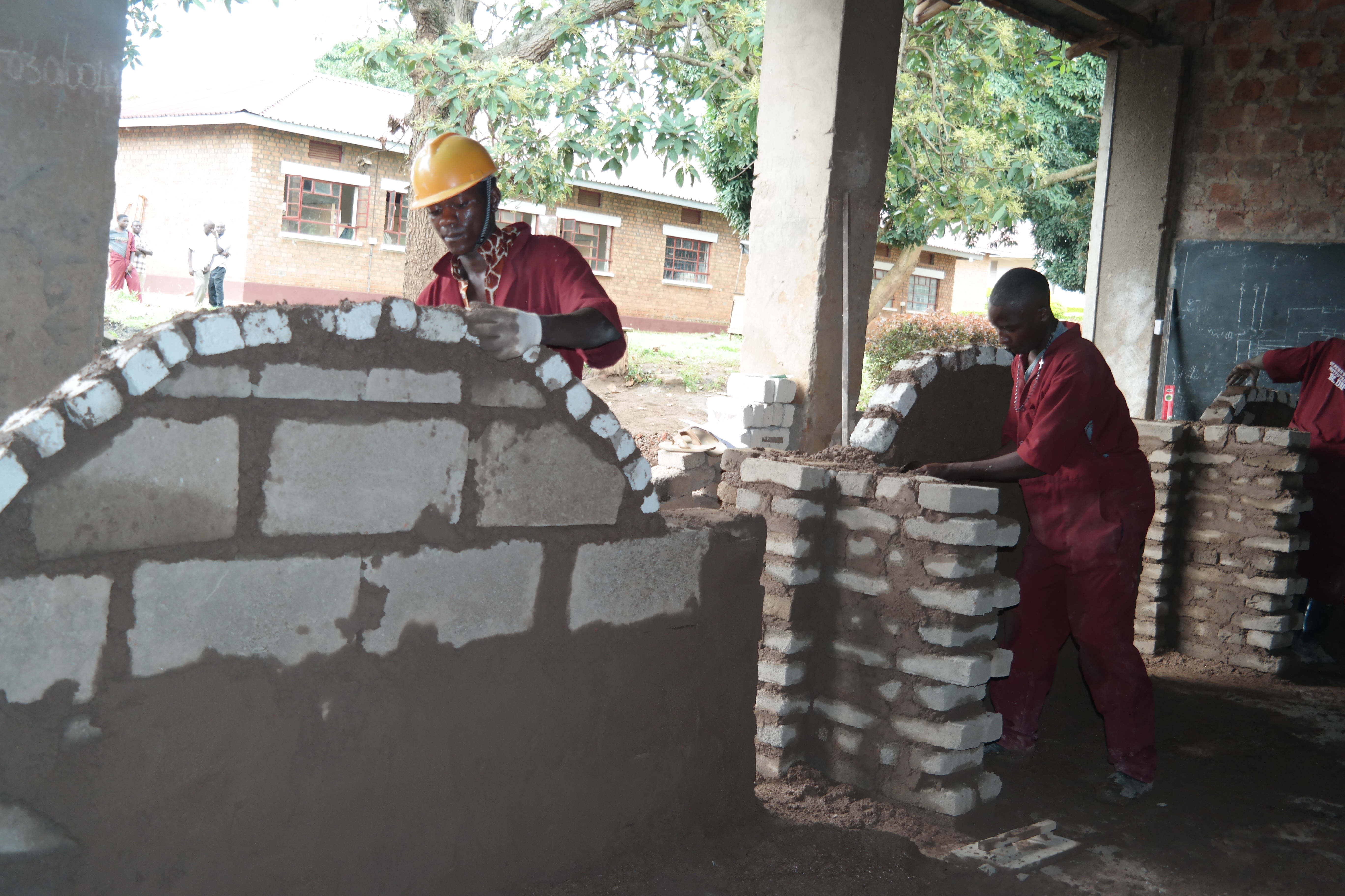 Students constructing a brick arch at St. Peter's Technical Institute Mubende