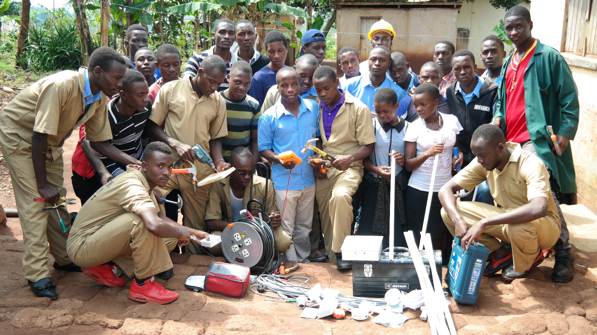 Electrical students with tools and equipment at St. Peter's VTI Mubende