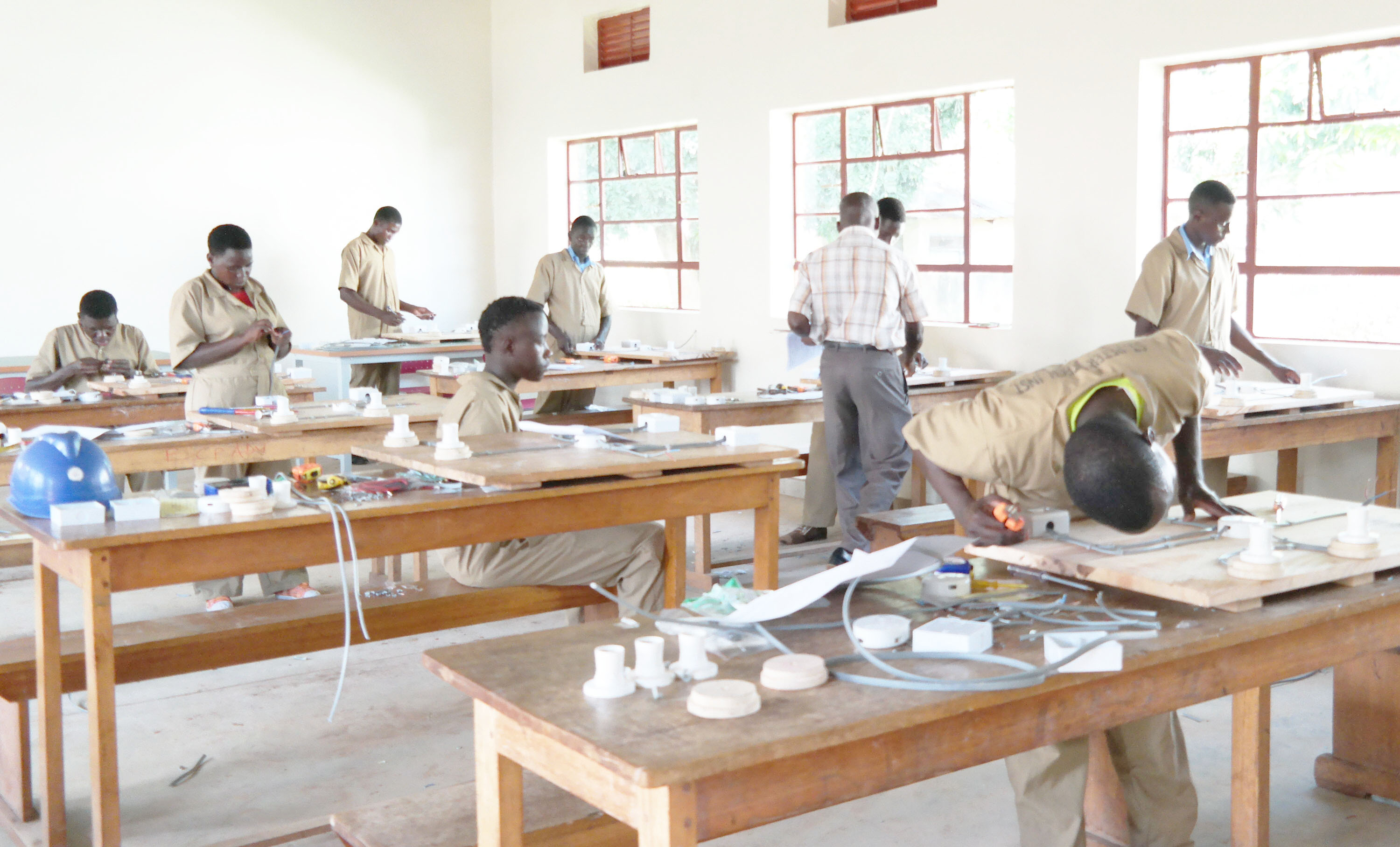 Students practicing wiring in the electrical workshop