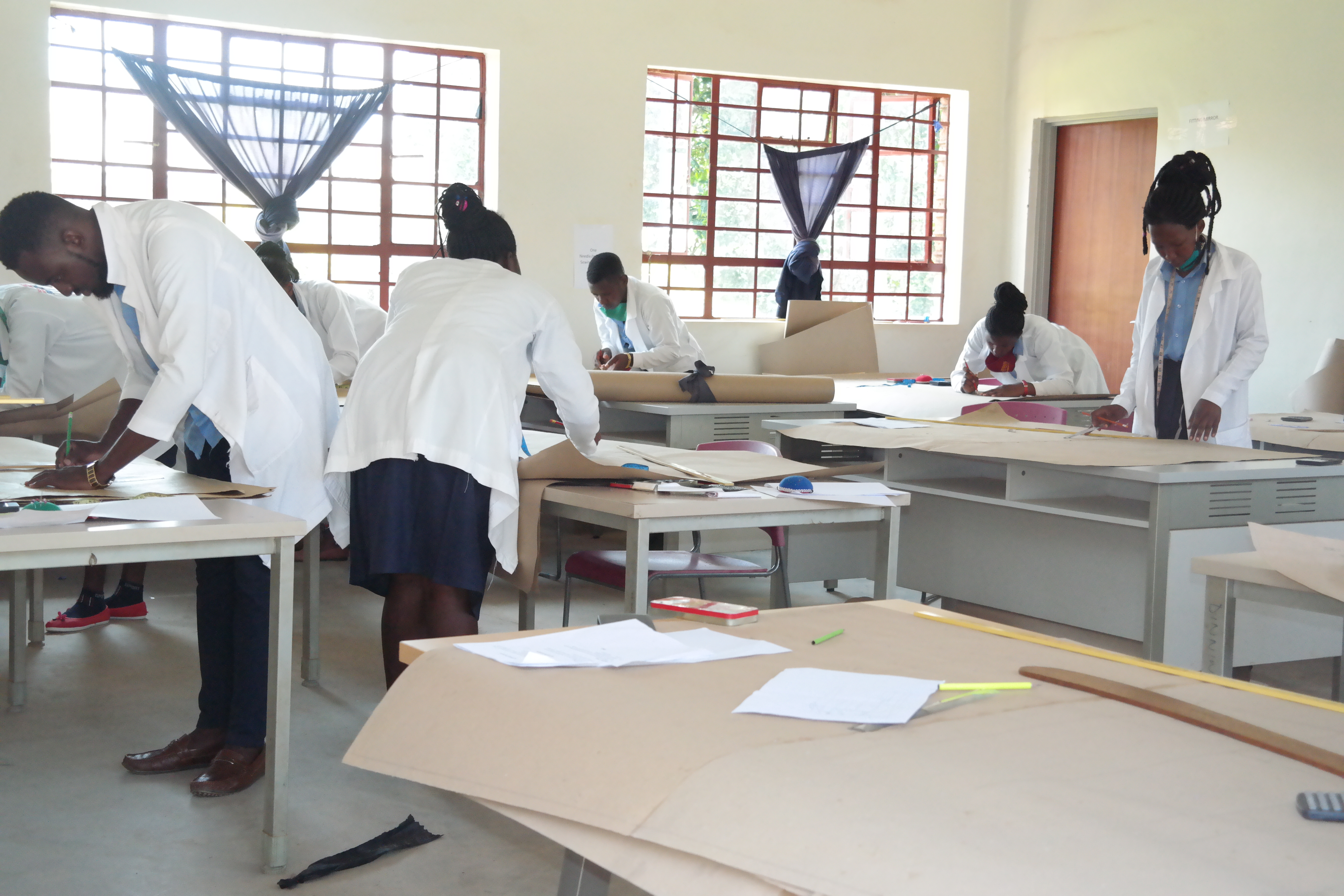 Fashion design theory and pattern drawing class in session