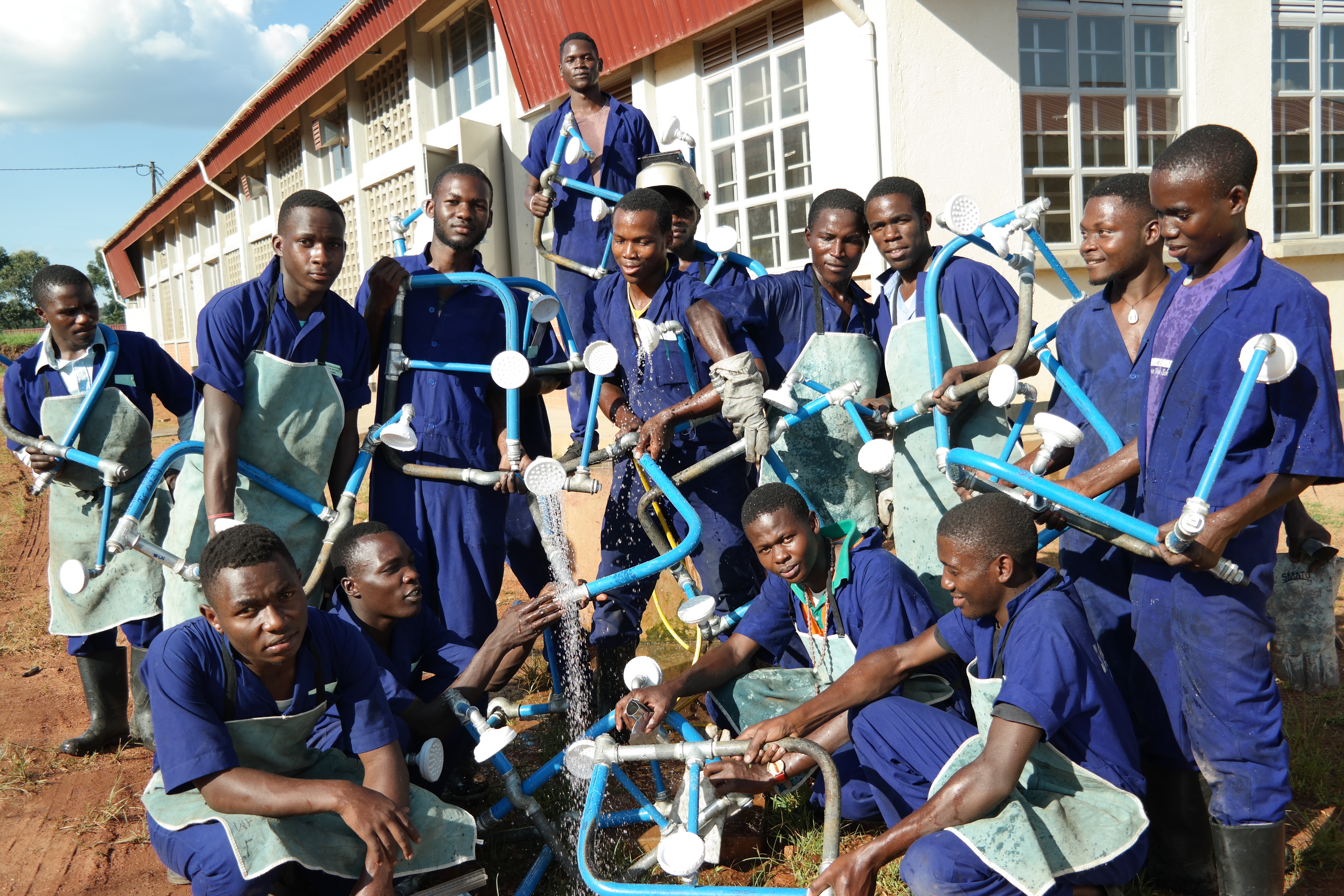 Students testing water pipe installations and pressure systems